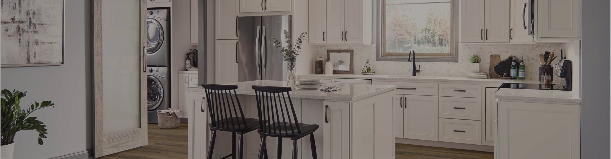 Kitchen with white cabinetry and wood-look flooring